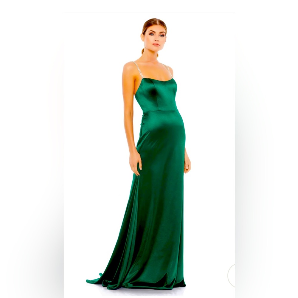 Gorgeous satin gown accented with shimmering crystal straps, sweeping train